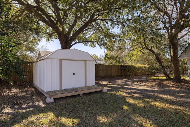 view of shed featuring a fenced backyard