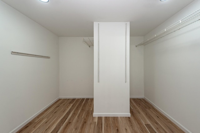 walk in closet featuring light hardwood / wood-style flooring