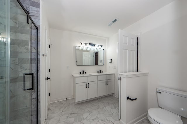 bathroom with vanity, toilet, and an enclosed shower