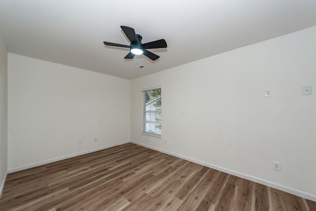 empty room featuring ceiling fan and wood-type flooring