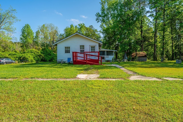 11341 Cottageville Hwy, Cottageville, SC 29435 - rear view of property featuring a yard and a sunroom
