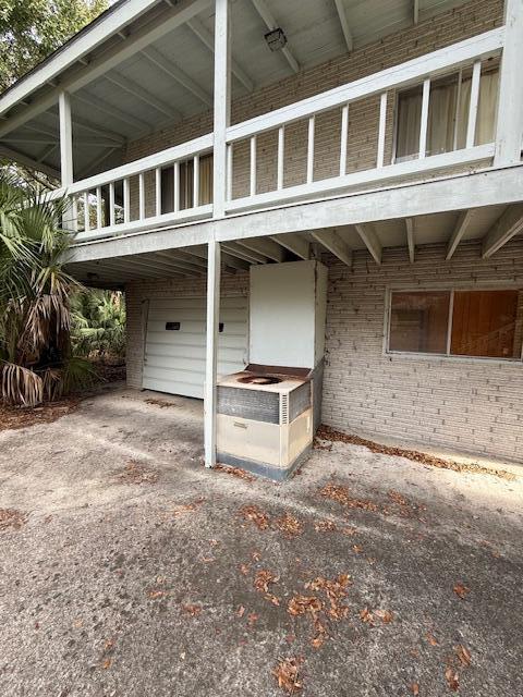 exterior space with a balcony and a garage