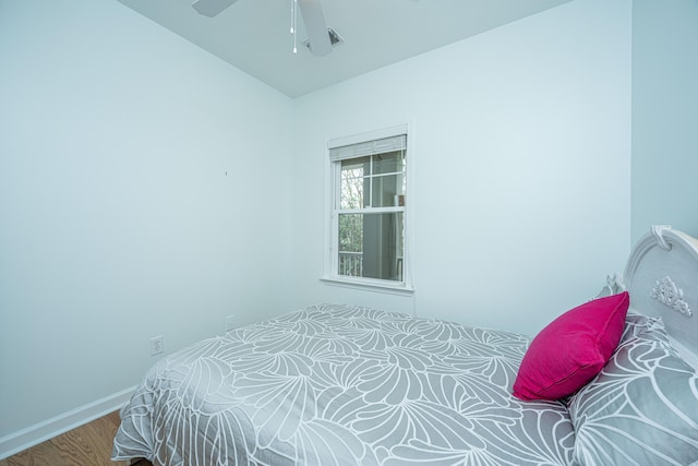 bedroom with hardwood / wood-style flooring and ceiling fan