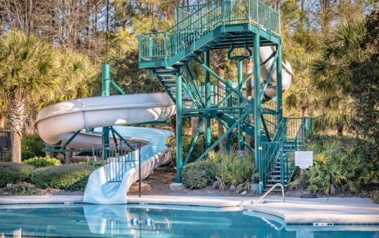 view of pool with a water slide