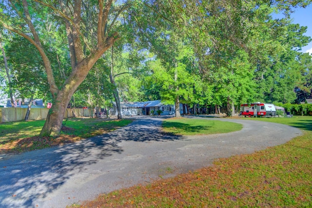 7074 W Constellation Dr, North Charleston, SC 29418 - obstructed view of property with asphalt driveway