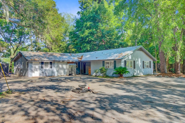 7074 W Constellation Dr, North Charleston, SC 29418 - ranch-style home featuring a metal roof and driveway