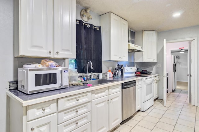 7074 W Constellation Dr, North Charleston, SC 29418 - kitchen featuring white appliances, white cabinets, light tile patterned flooring, light countertops, and recessed lighting