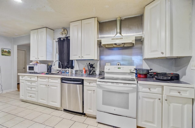 7074 W Constellation Dr, North Charleston, SC 29418 - kitchen featuring white appliances, white cabinets, light countertops, light tile patterned floors, and a textured ceiling