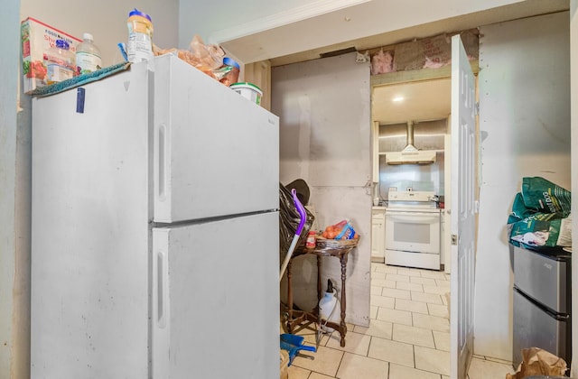 7074 W Constellation Dr, North Charleston, SC 29418 - kitchen featuring white appliances, light tile patterned floors, white cabinets, and ventilation hood