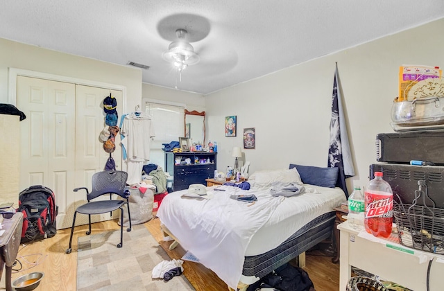 7074 W Constellation Dr, North Charleston, SC 29418 - bedroom featuring a closet, ceiling fan, and wood finished floors
