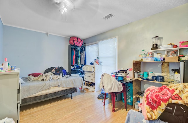 7074 W Constellation Dr, North Charleston, SC 29418 - bedroom with wood finished floors and ceiling fan