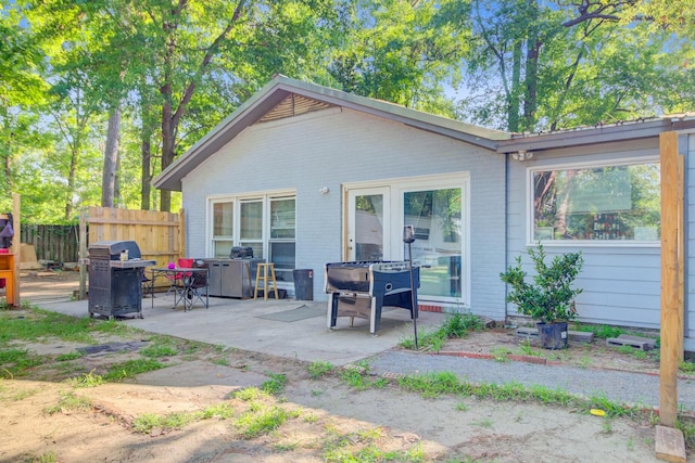7074 W Constellation Dr, North Charleston, SC 29418 - rear view of property with a patio area and brick siding