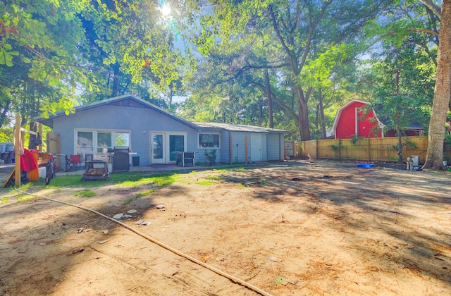 7074 W Constellation Dr, North Charleston, SC 29418 - rear view of house featuring french doors
