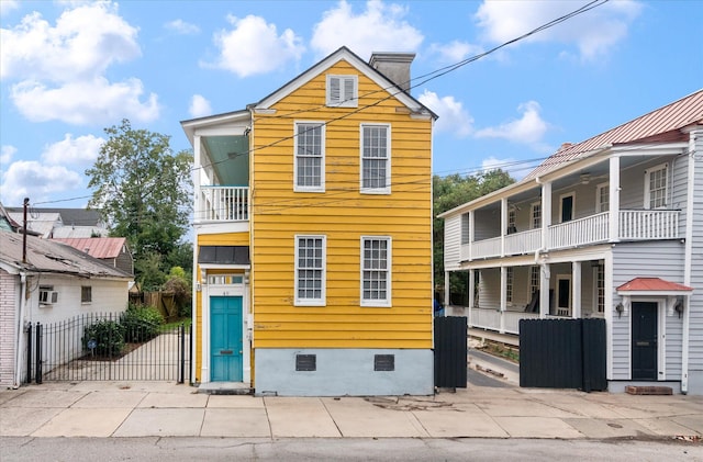 front of property featuring a balcony