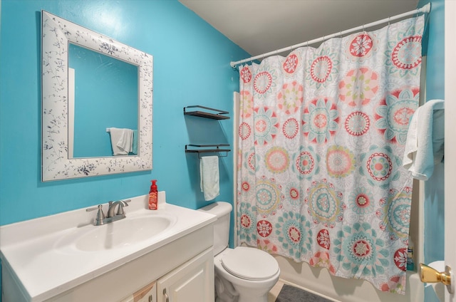 full bathroom with vanity, toilet, and shower / tub combo