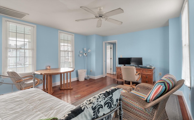 interior space with hardwood / wood-style floors, plenty of natural light, and ceiling fan