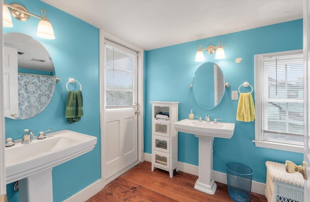 bathroom with wood-type flooring