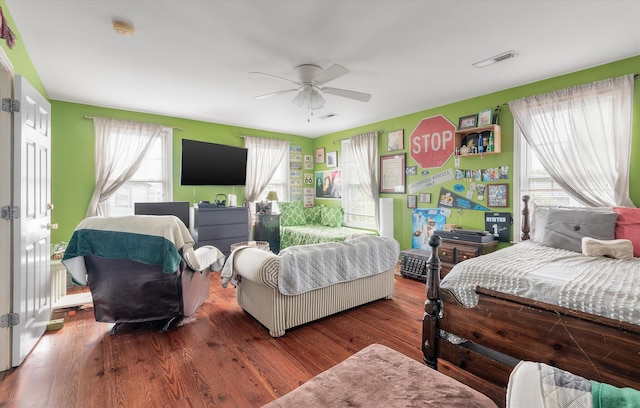 bedroom with hardwood / wood-style flooring and ceiling fan