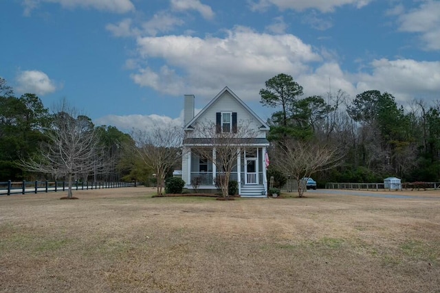 view of front facade featuring a front lawn and a porch