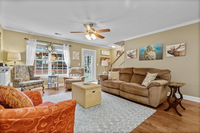 1583 Southwick Dr, Johns Island, SC 29455 - living area with wood finished floors, ceiling fan, ornamental molding, baseboards, and stairs