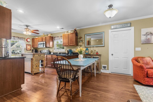 1583 Southwick Dr, Johns Island, SC 29455 - dining room with crown molding, ceiling fan, dark wood-style flooring, and recessed lighting