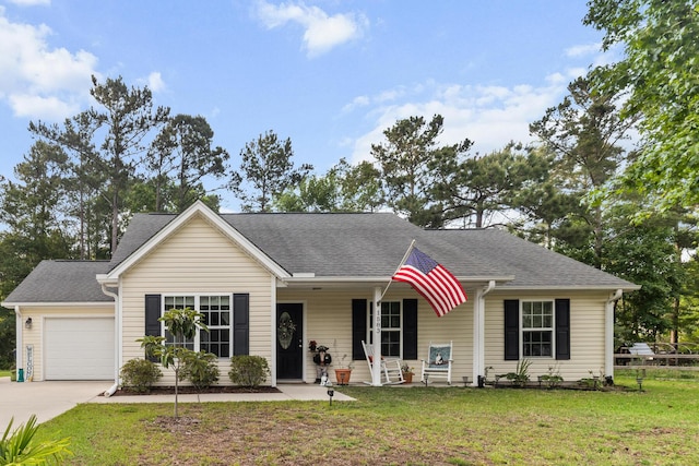 1583 Southwick Dr, Johns Island, SC 29455 - view of front of home featuring a garage, concrete driveway, a front yard, a porch, and a shingled roof