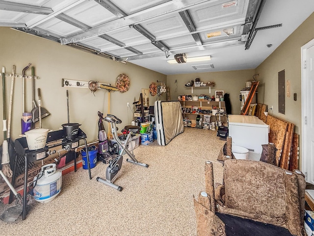 1583 Southwick Dr, Johns Island, SC 29455 - garage featuring electric panel, a garage door opener, and fridge