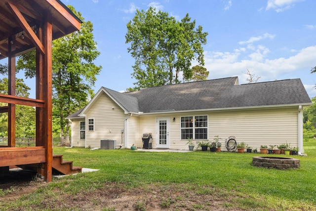 1583 Southwick Dr, Johns Island, SC 29455 - rear view of house featuring a fire pit, a yard, and a shingled roof