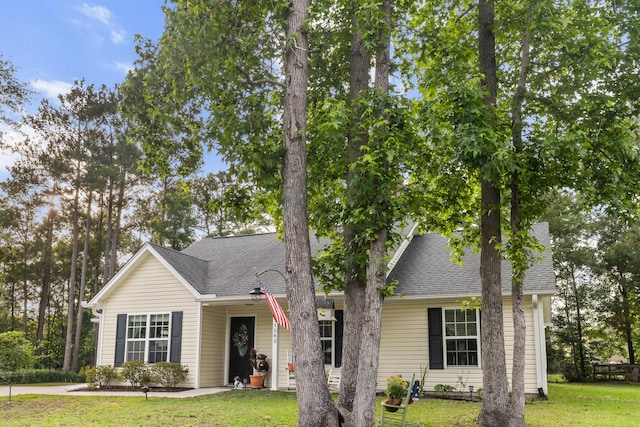 1583 Southwick Dr, Johns Island, SC 29455 - view of front of house with a front yard and roof with shingles