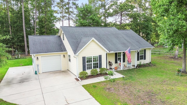 1583 Southwick Dr, Johns Island, SC 29455 - view of front of house with a garage, driveway, a front lawn, and covered porch