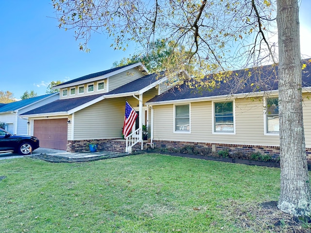 view of front of house with a garage and a front yard