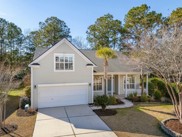 traditional-style house with covered porch, concrete driveway, a shingled roof, and a garage