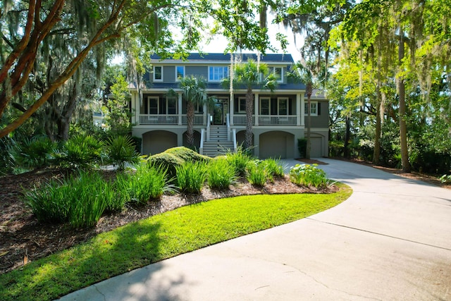 view of front of property with a garage and covered porch