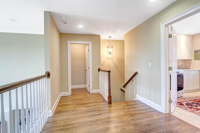 corridor featuring light wood-type flooring