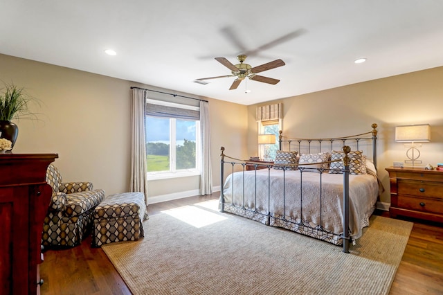 bedroom featuring wood-type flooring and ceiling fan