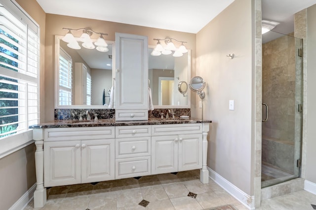 bathroom with vanity, tile patterned flooring, and a shower with door