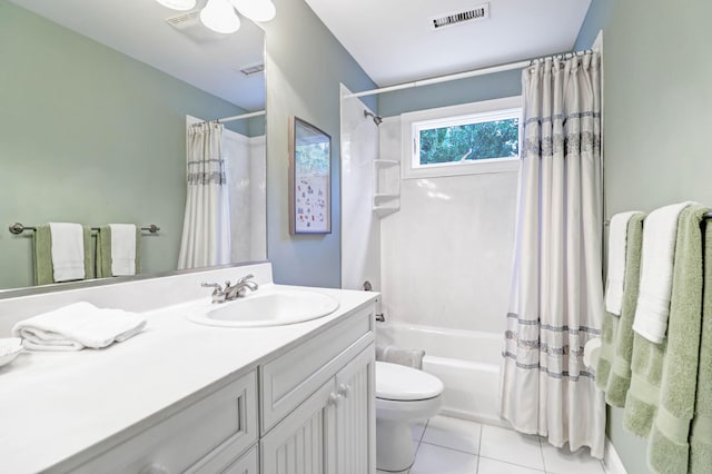 full bathroom with shower / tub combo with curtain, vanity, toilet, and tile patterned flooring