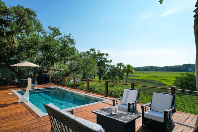 view of pool featuring a wooden deck