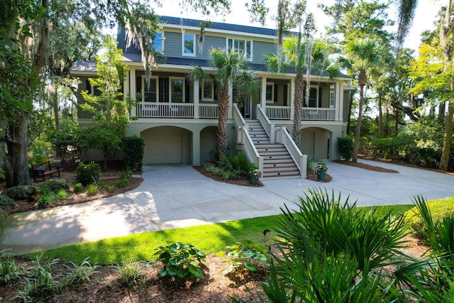 view of front of home featuring a porch and a garage