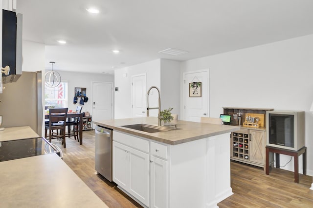 127 Rosefield Ct, Summerville, SC 29485 - kitchen with a sink, appliances with stainless steel finishes, wood finished floors, and white cabinets