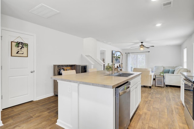 127 Rosefield Ct, Summerville, SC 29485 - kitchen with visible vents, stainless steel appliances, open floor plan, and a sink