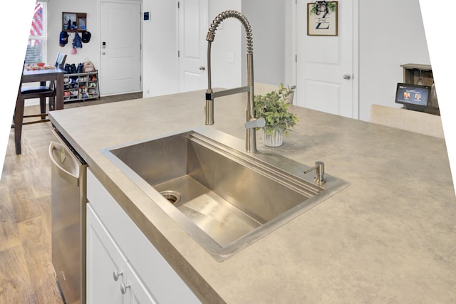 127 Rosefield Ct, Summerville, SC 29485 - interior details with light wood finished floors, a sink, stainless steel dishwasher, white cabinets, and light countertops