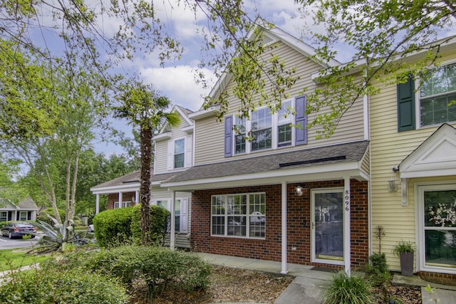 8096 Shadow Oak Dr, North Charleston, SC 29406 - view of front of house with brick siding and a shingled roof