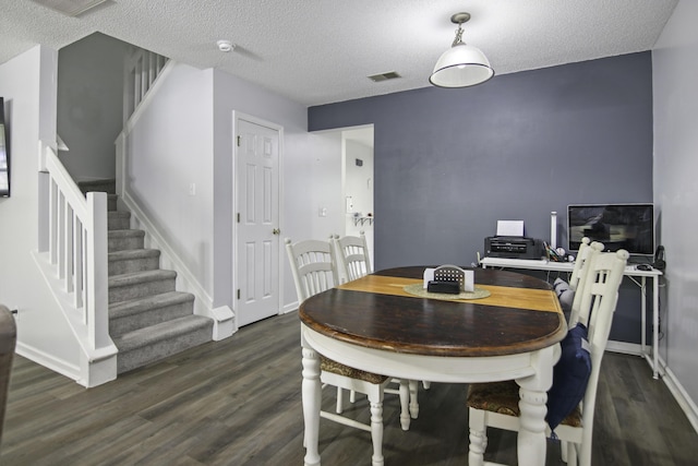 8096 Shadow Oak Dr, North Charleston, SC 29406 - dining room with dark wood finished floors, stairs, a textured ceiling, and baseboards