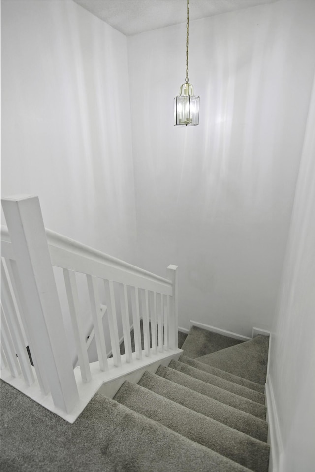 8096 Shadow Oak Dr, North Charleston, SC 29406 - staircase with a chandelier and carpet flooring
