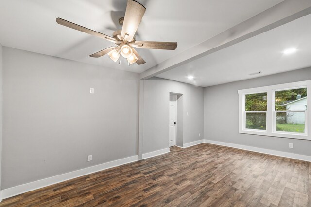 spare room featuring ceiling fan and dark hardwood / wood-style flooring