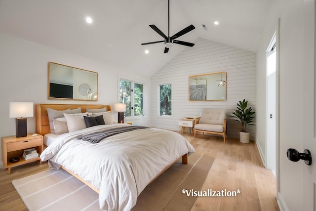 bedroom featuring light wood-type flooring, vaulted ceiling, and ceiling fan