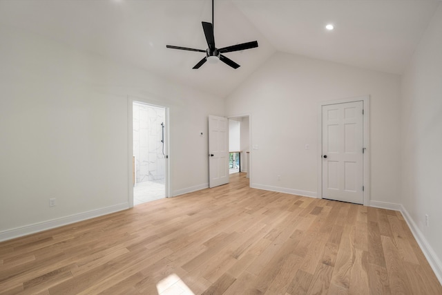 unfurnished bedroom featuring light hardwood / wood-style floors, high vaulted ceiling, ceiling fan, and ensuite bathroom