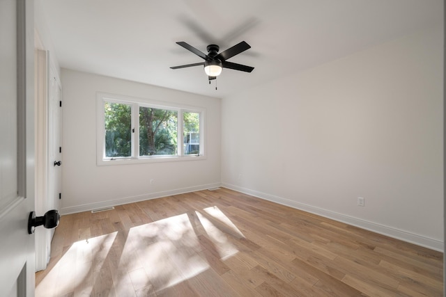 spare room with ceiling fan and light hardwood / wood-style floors