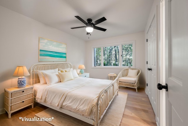 bedroom with ceiling fan, a closet, and light hardwood / wood-style flooring